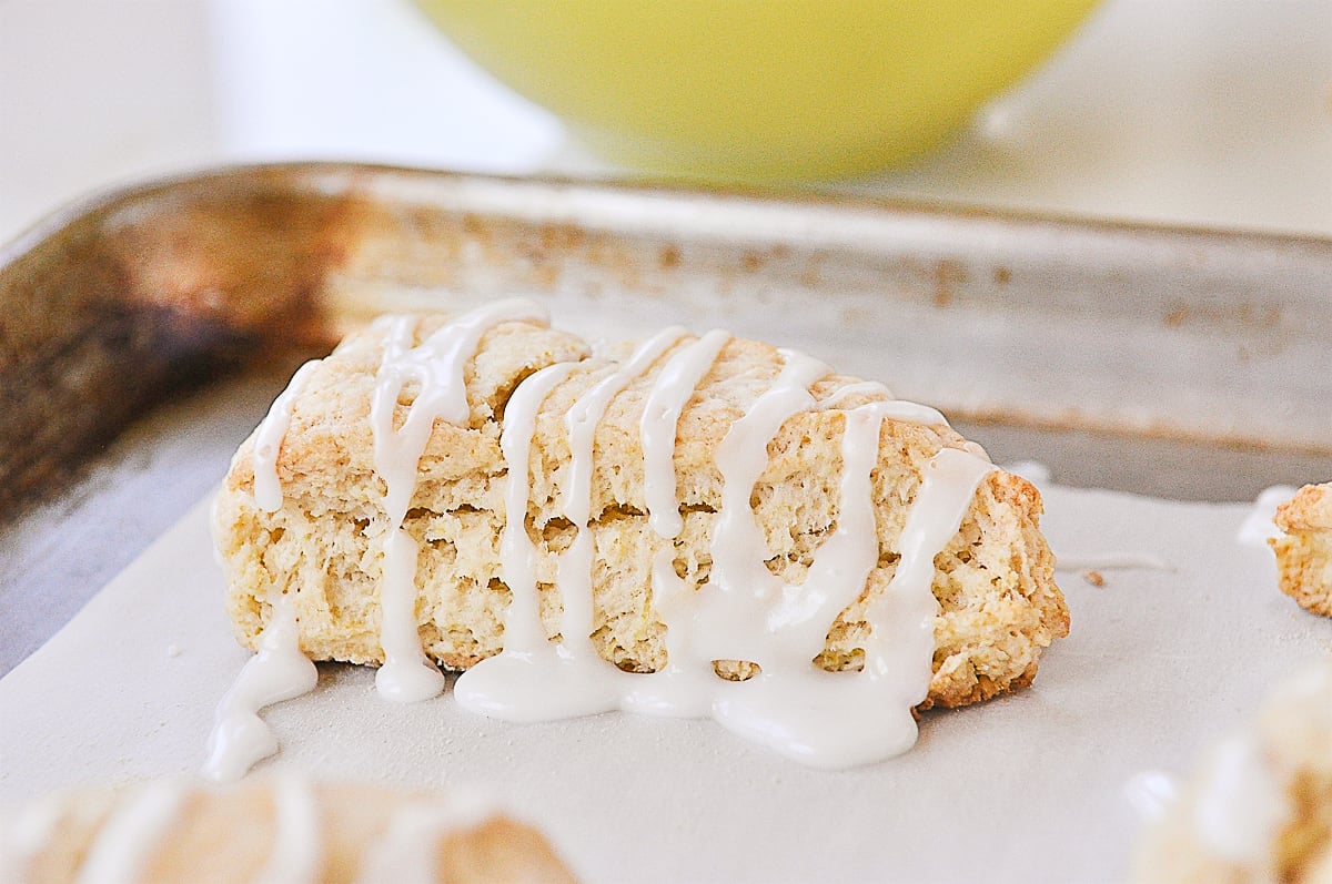 lemon scone on a parchment lined baking sheet