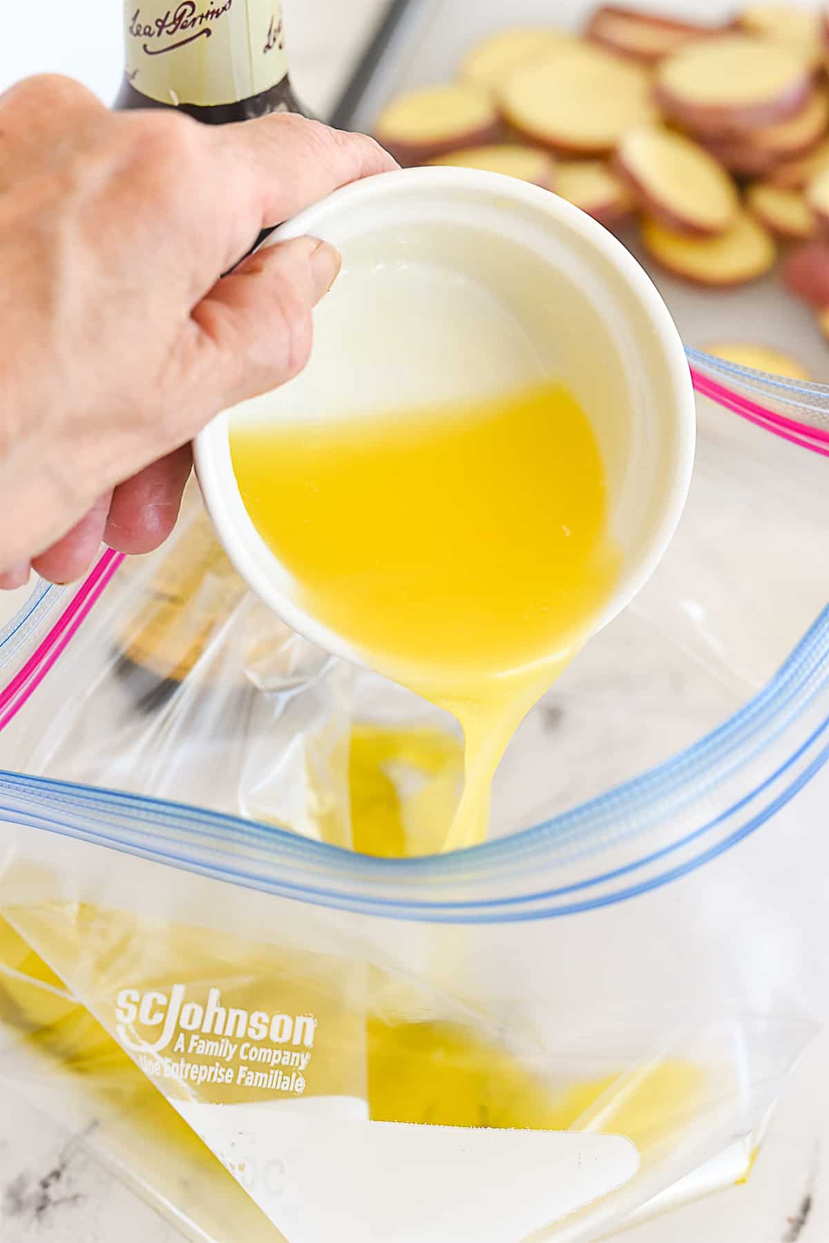 adding melted butter to bag