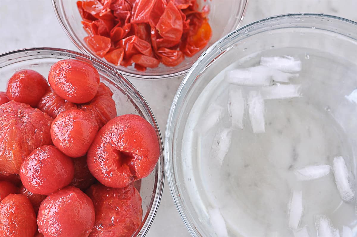 peeling tomatoes in a bowl