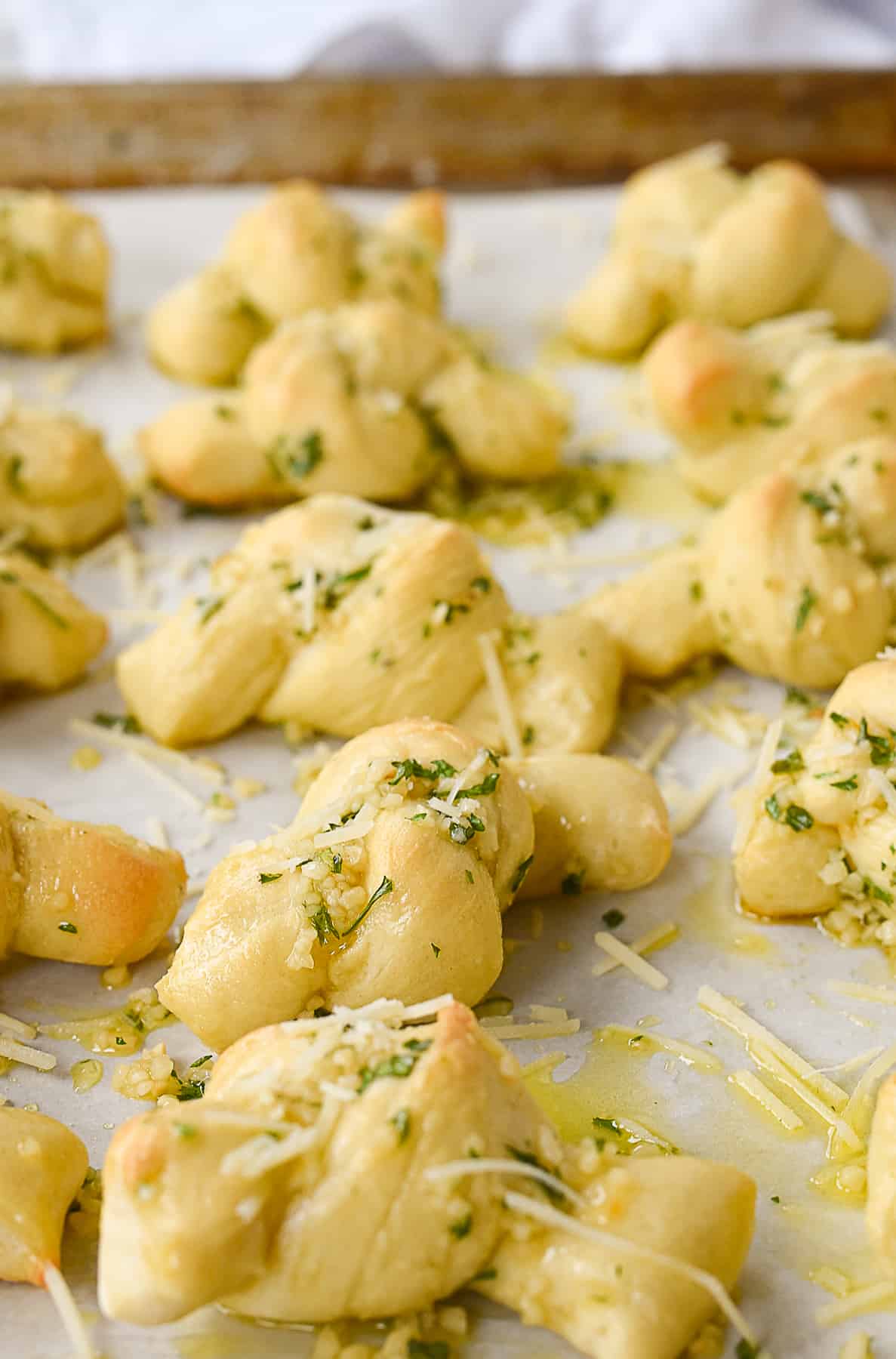 garlic knots on a baking sheet