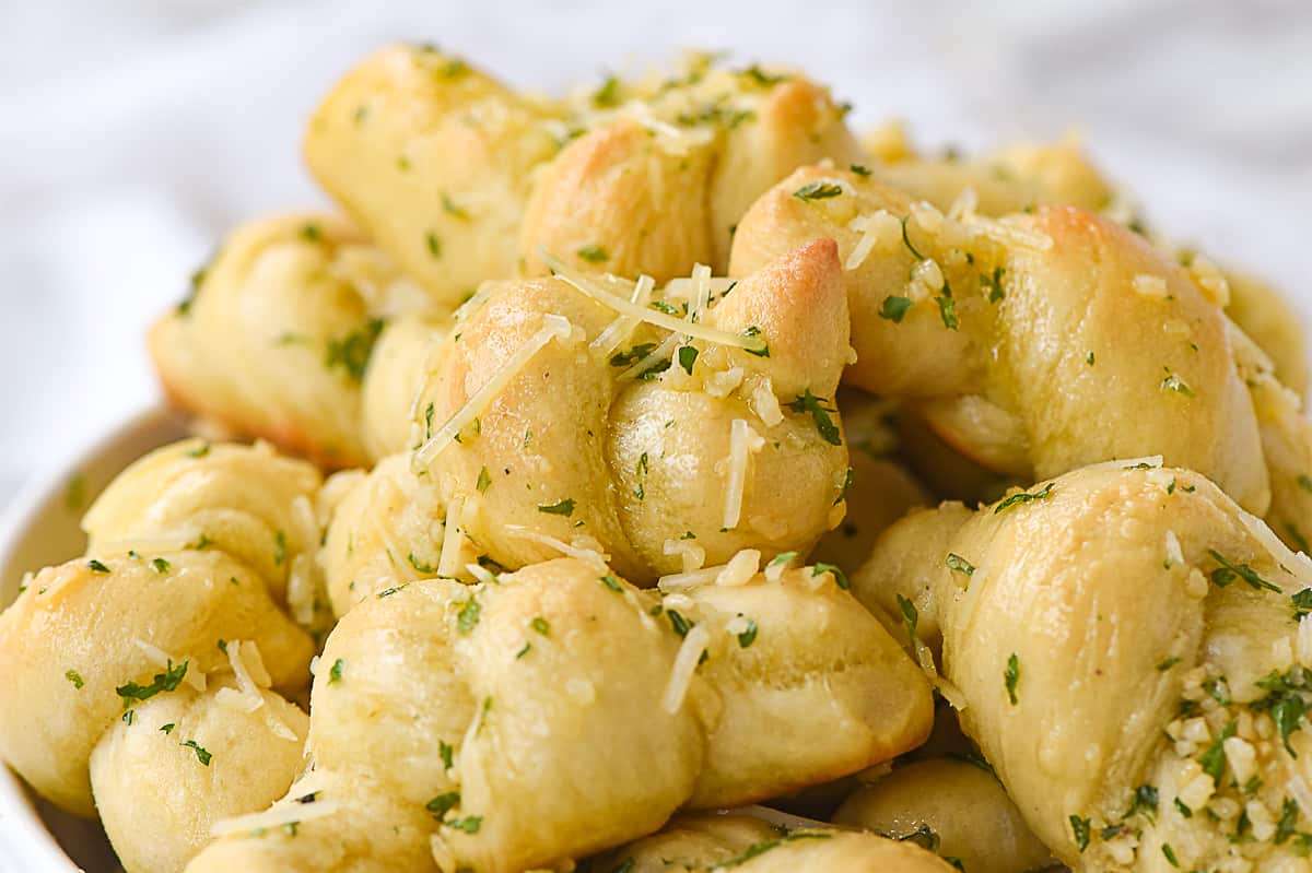garlic knots with cheese on top