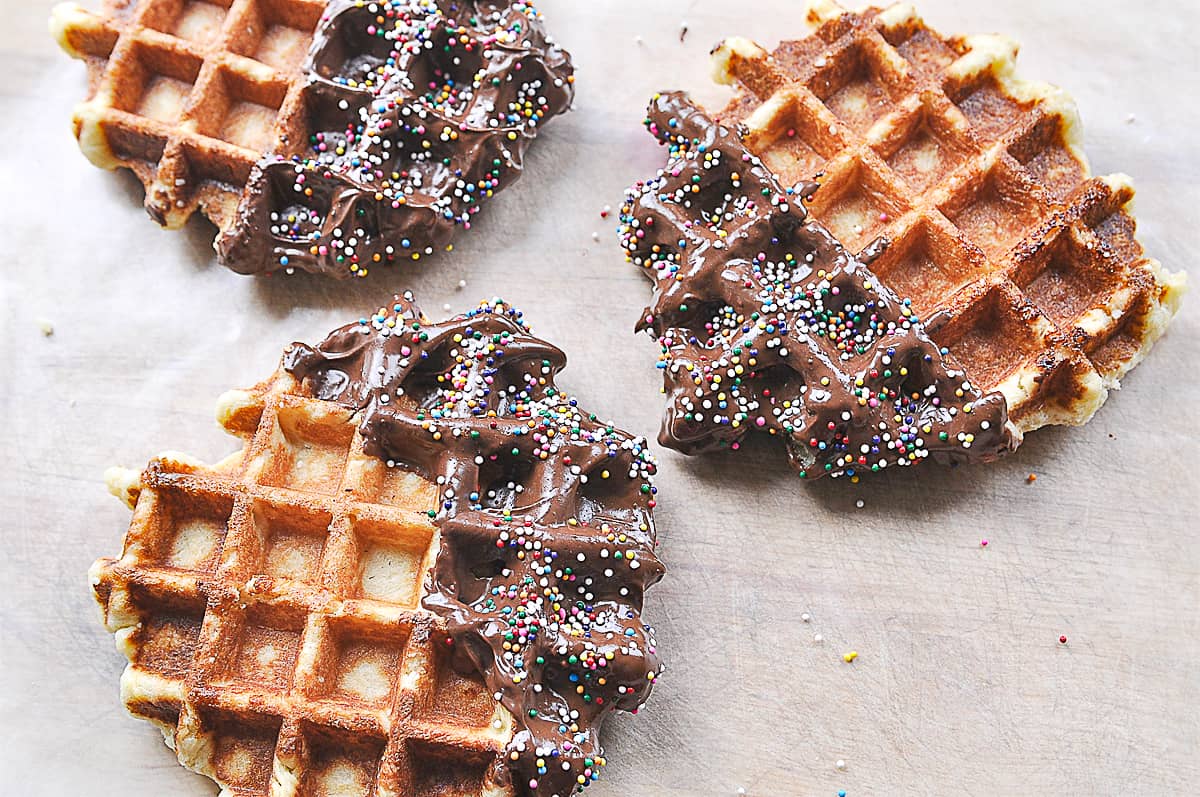 three liege waffles dipped in chocolate
