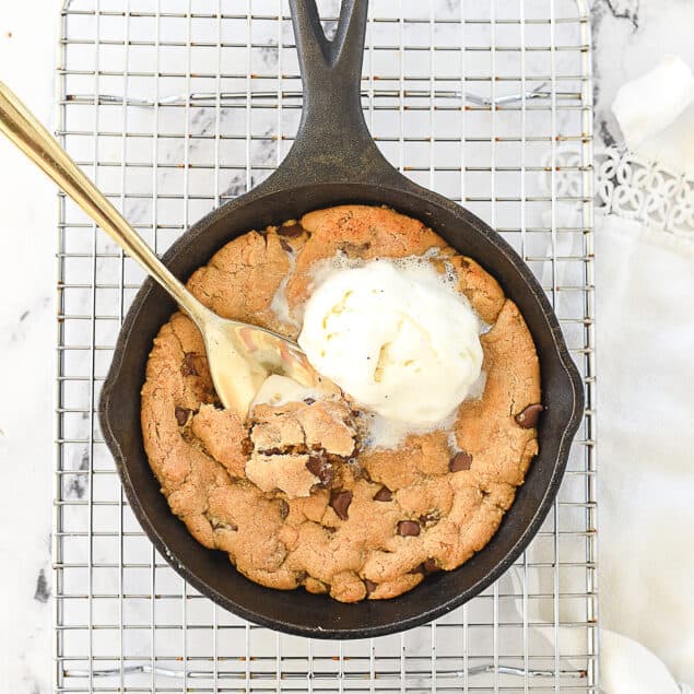 peanut butter skillet cookie with ice cream on top.