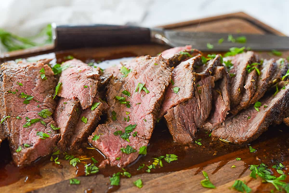 slices of tri tip on a cutting board