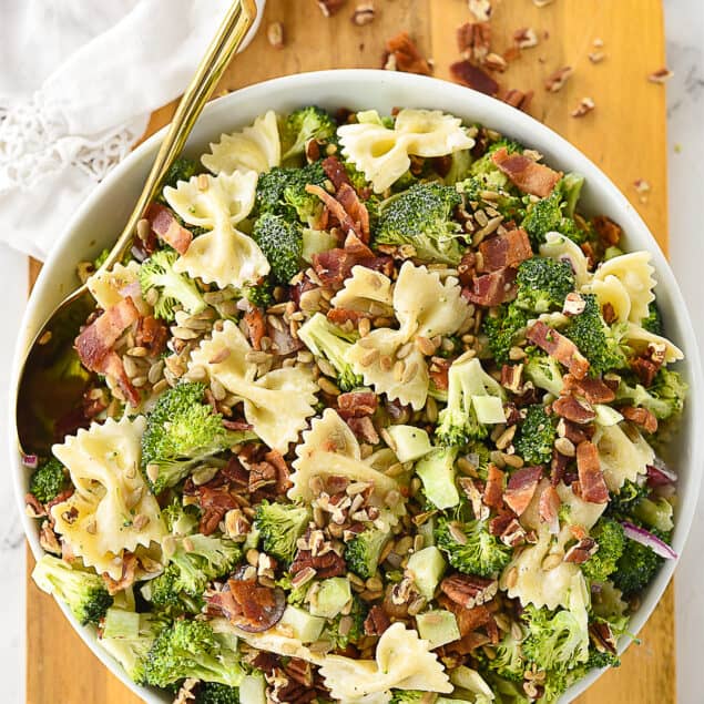 overhead shot of broccoli pasta salad in white bowl