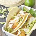 fish tacos with slaw on top