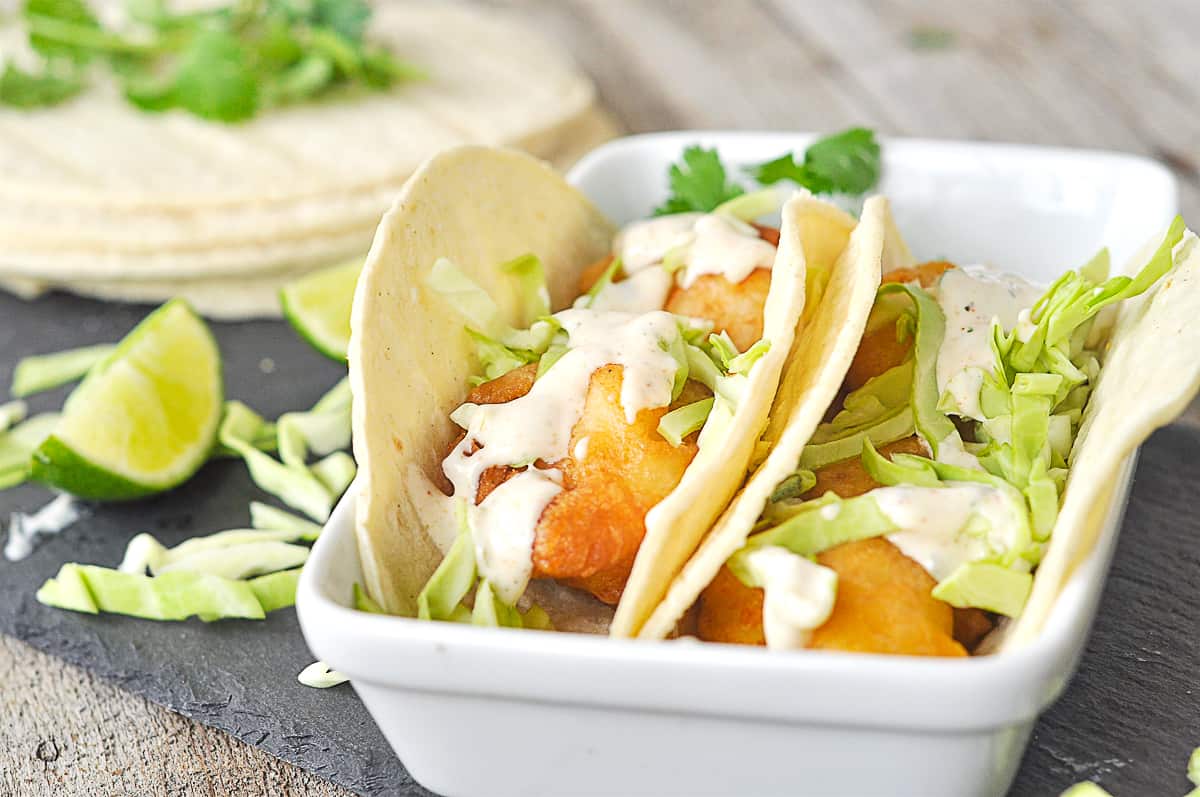 fish tacos in a white dish