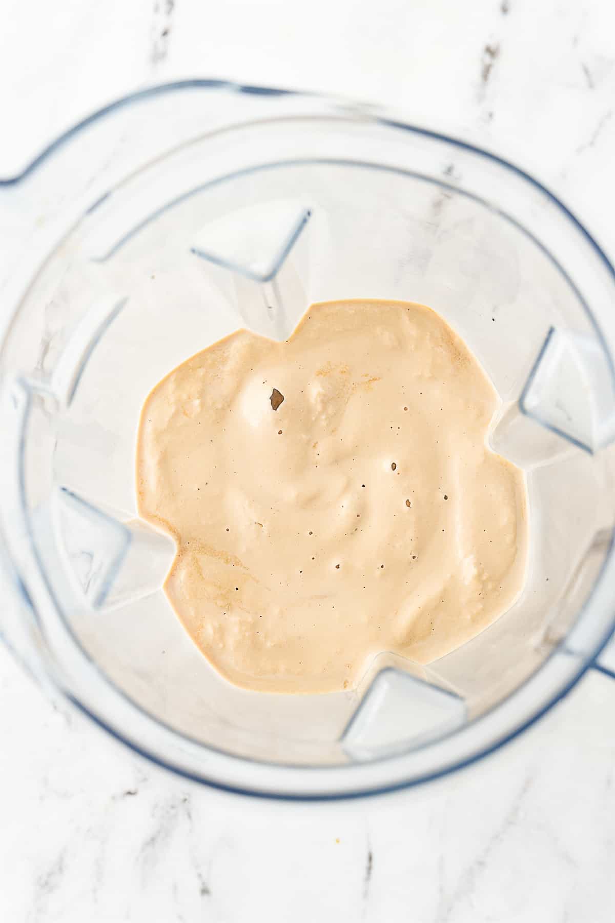 overhead shot of root beer milkshake in blender