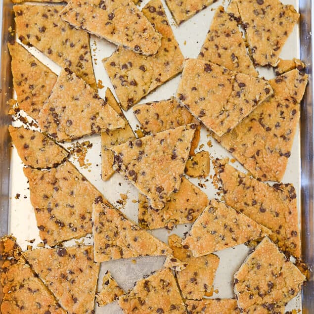 overhead shot of chocolate chip cookie brittle on baking sheet