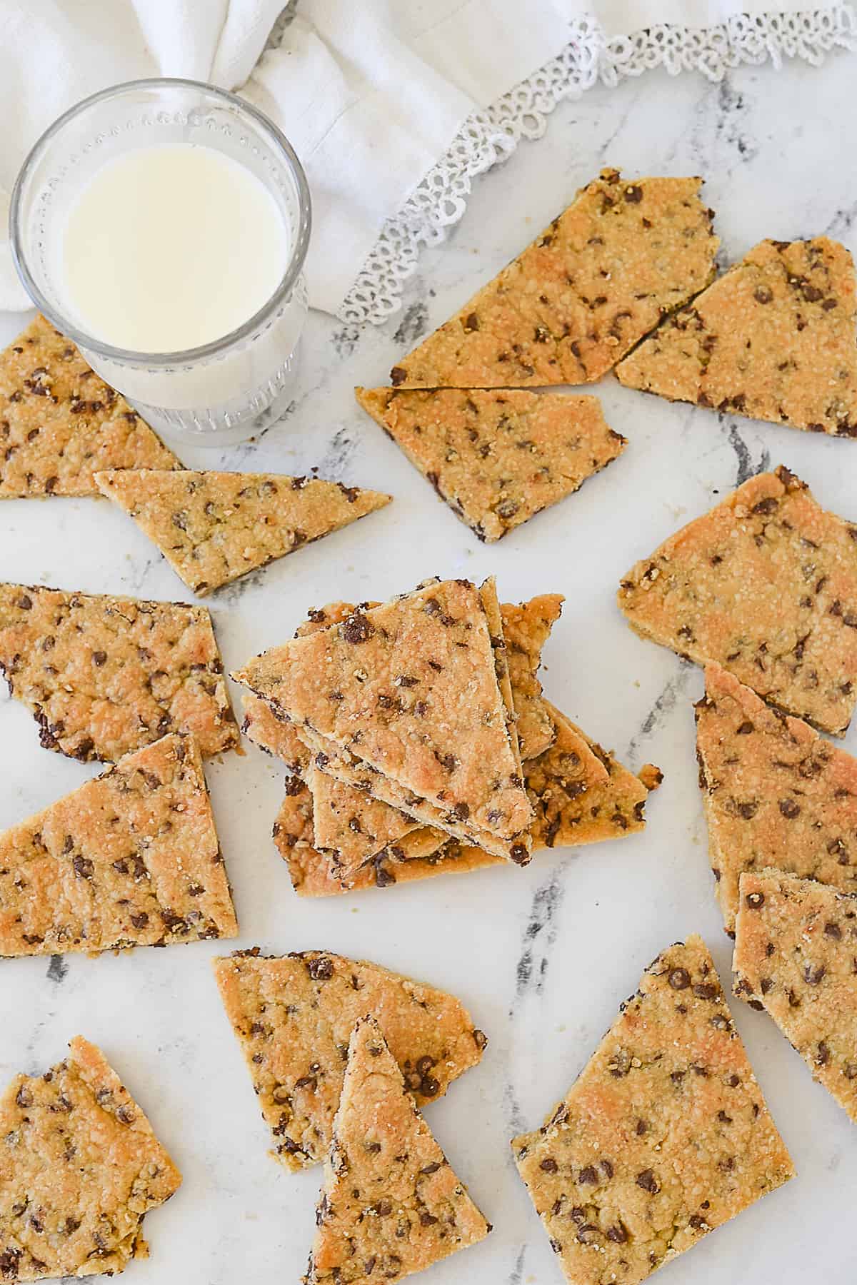cookie brittle on counter with glass of milk