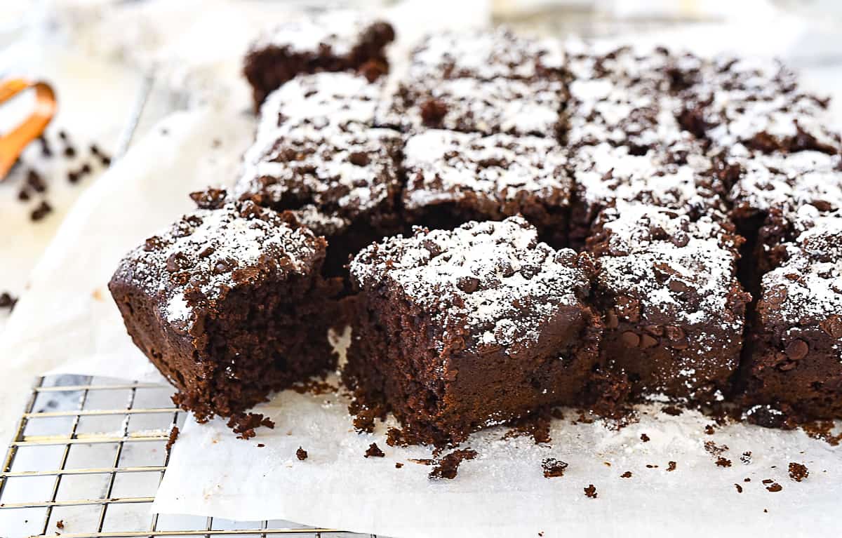 squares of chocolate snack cake on cooling rack