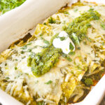 baked green chili enchiladas in a white pan