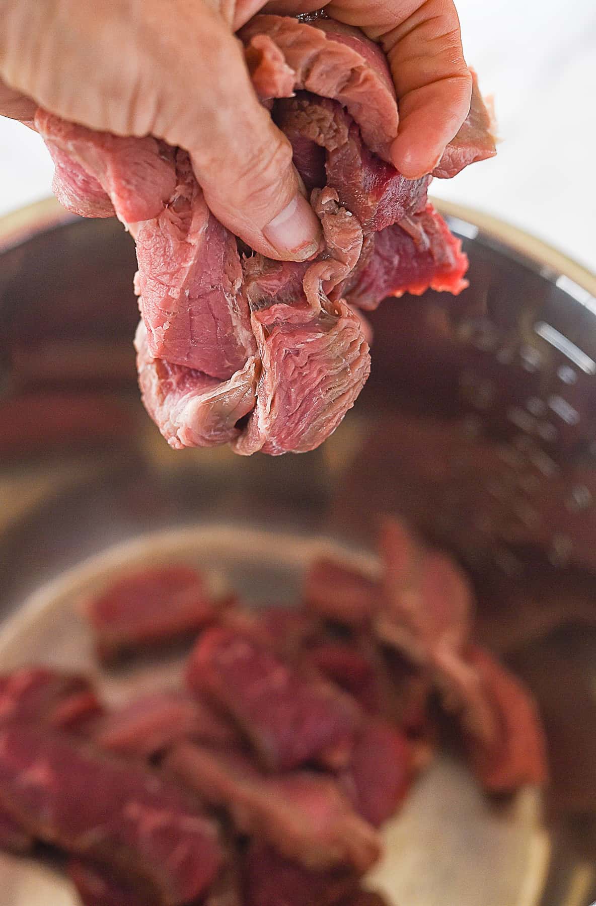 putting slice beef into instant pot