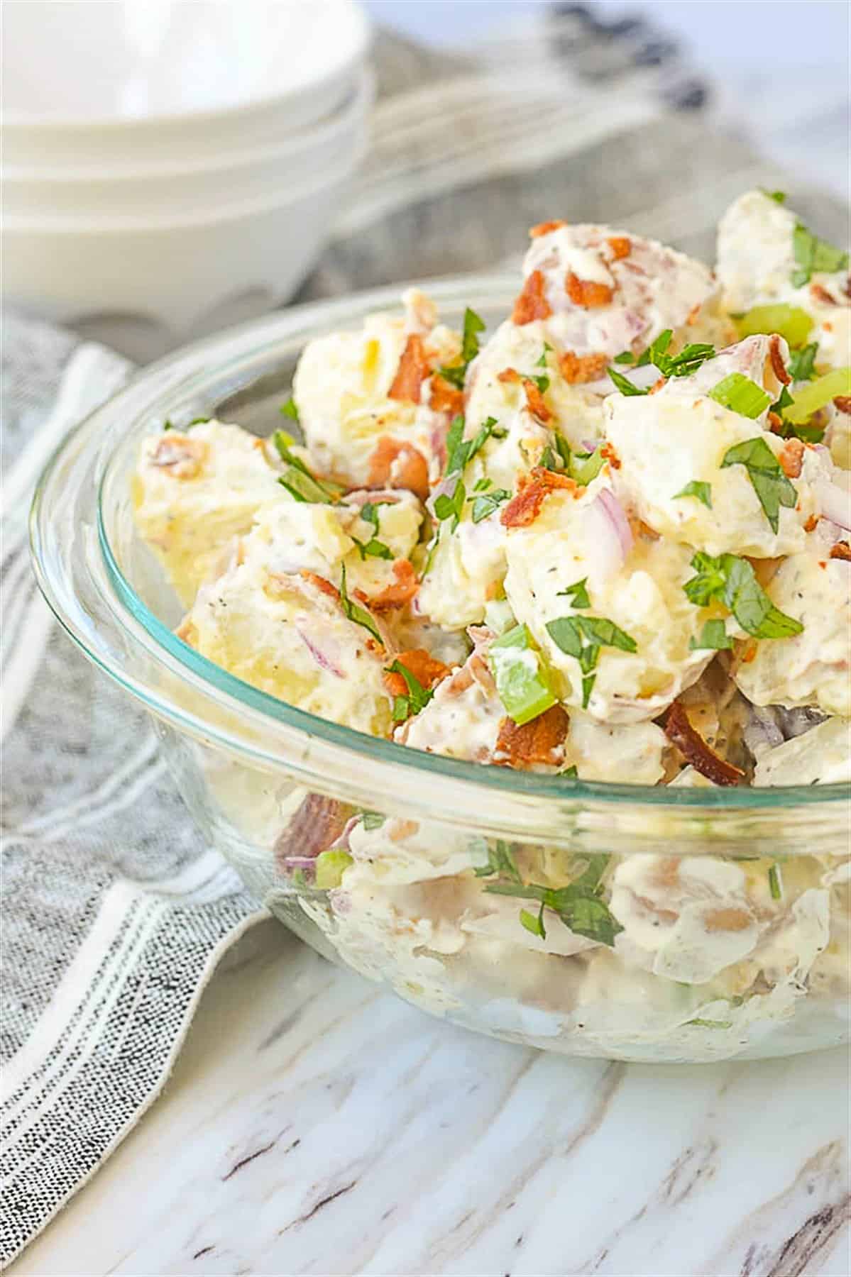 bowl of potato salad in a clear bowl