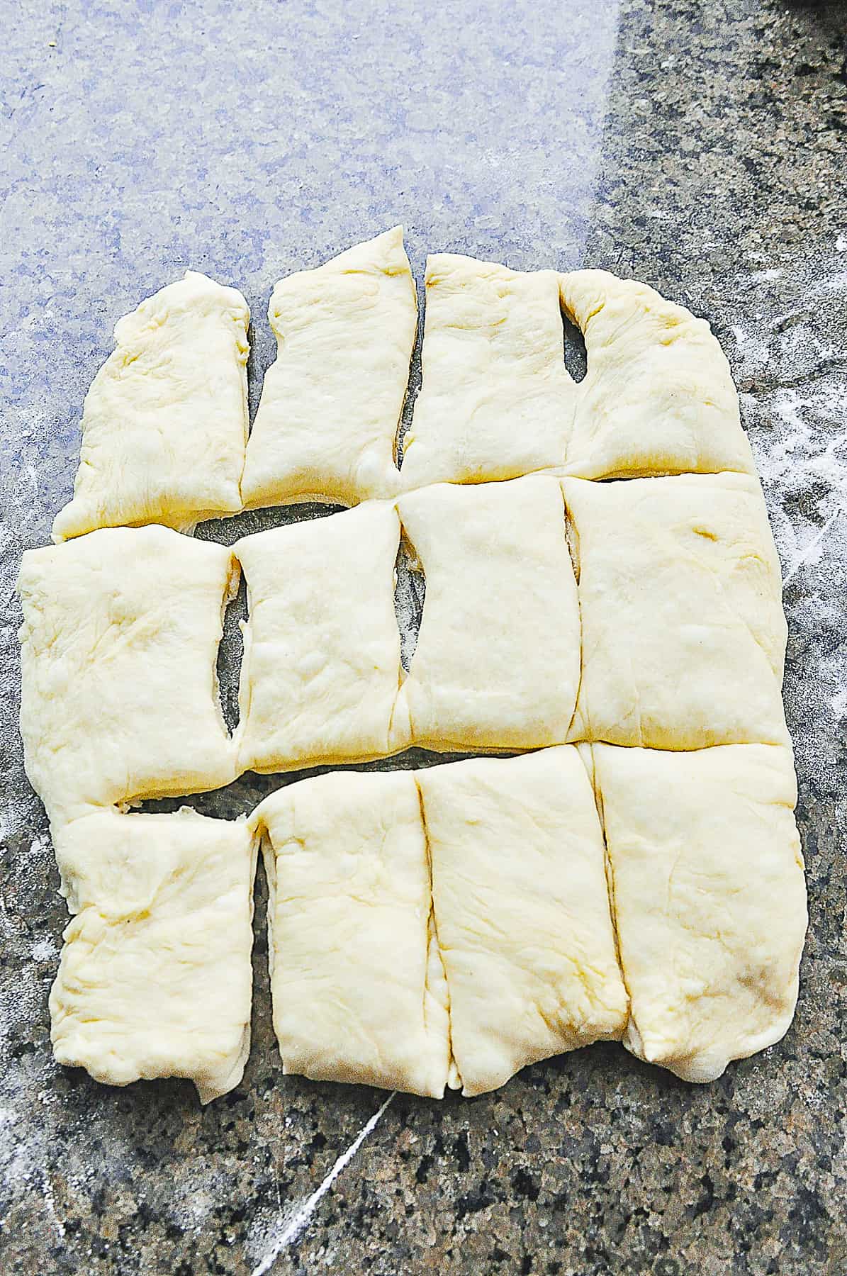 cutting dough for fluffy dinner rolls