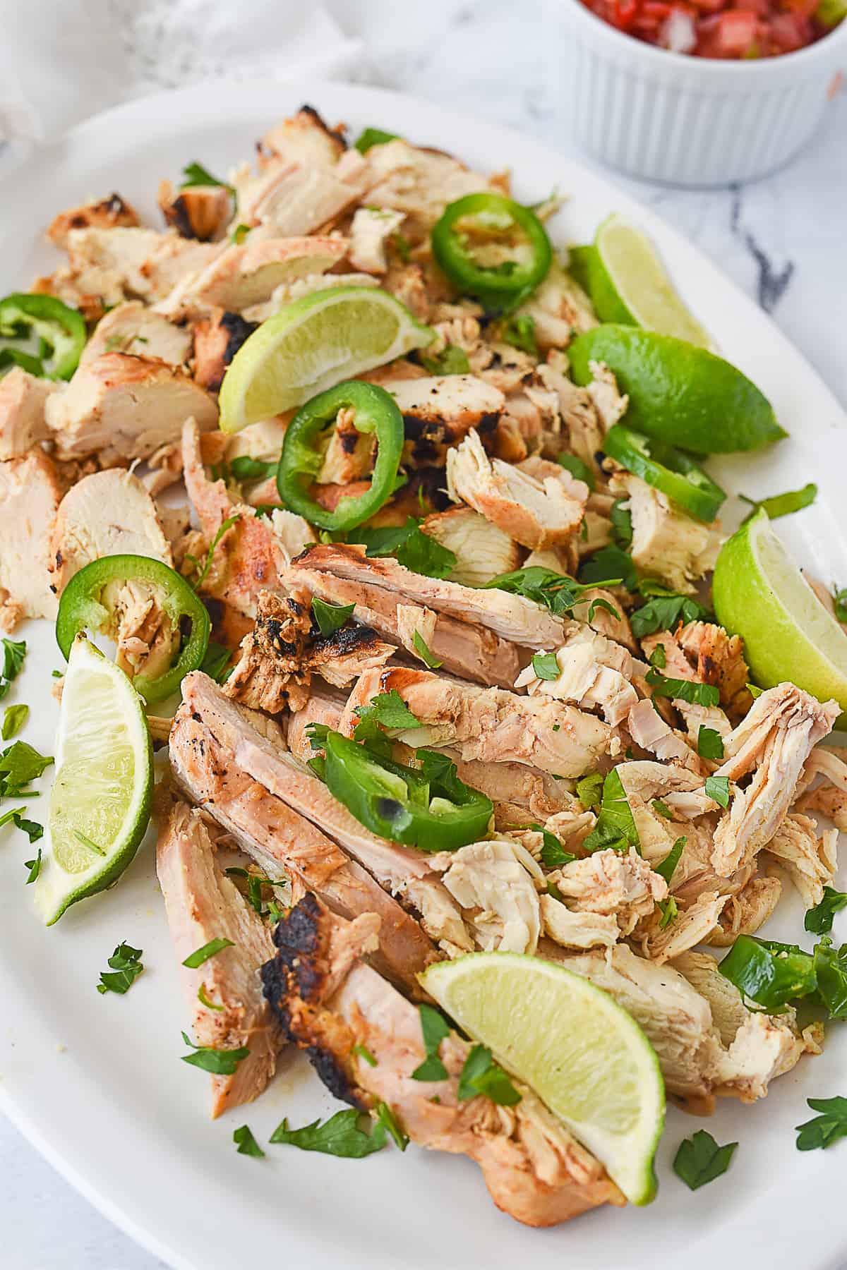 plate full of grilled chicken for tacos