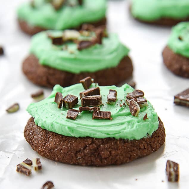 row of chocolate cookies with mint frosting