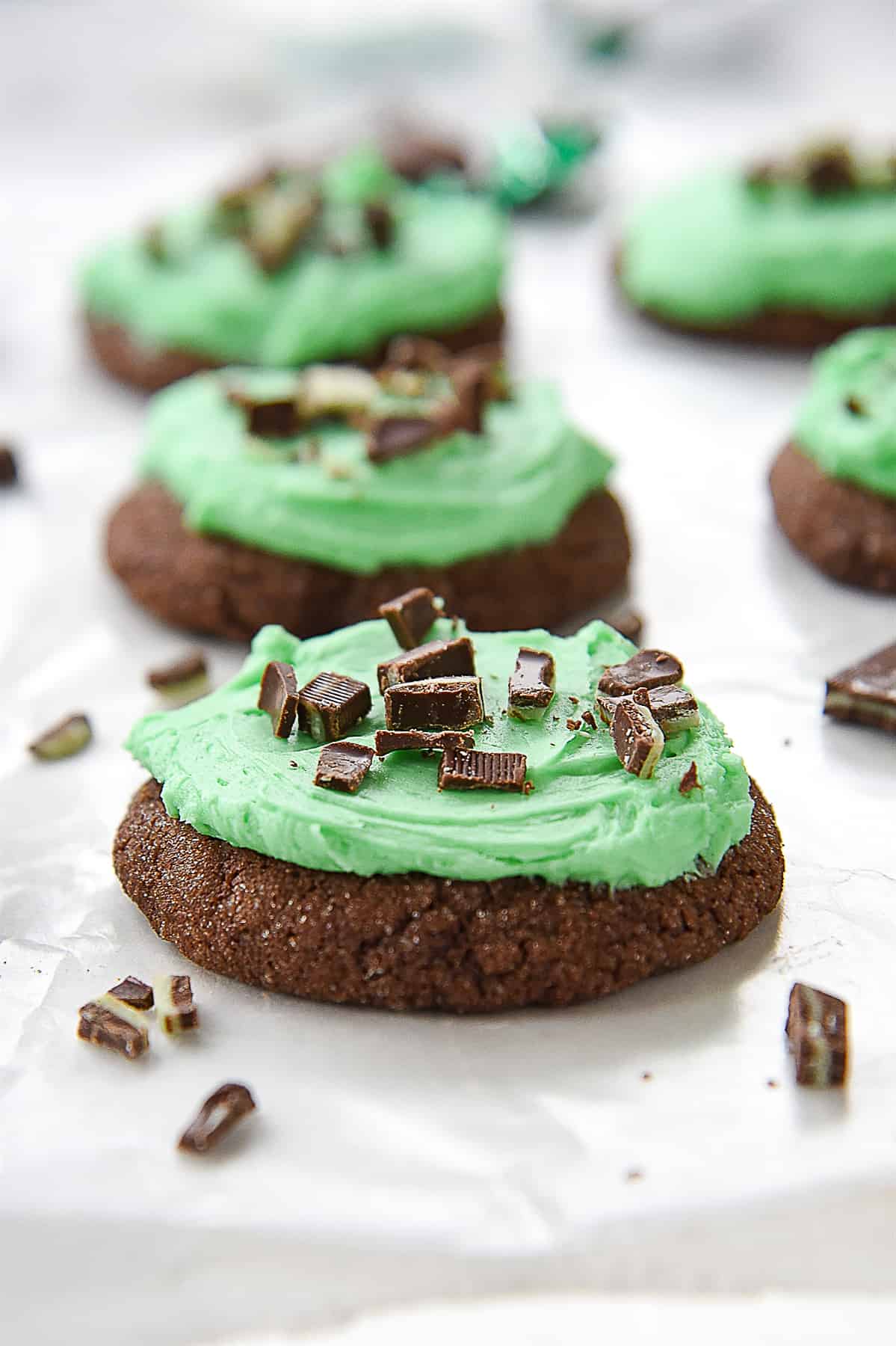 row of chocolate cookies with mint frosting