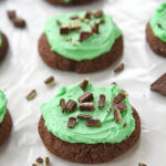 row of chocolate mint cookies with green frosting