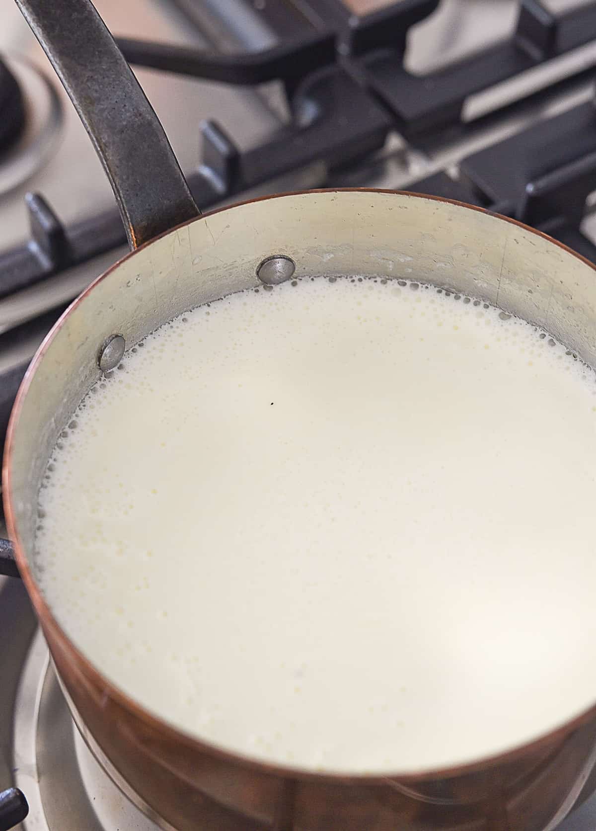 milk in pan with bubbles around the edge