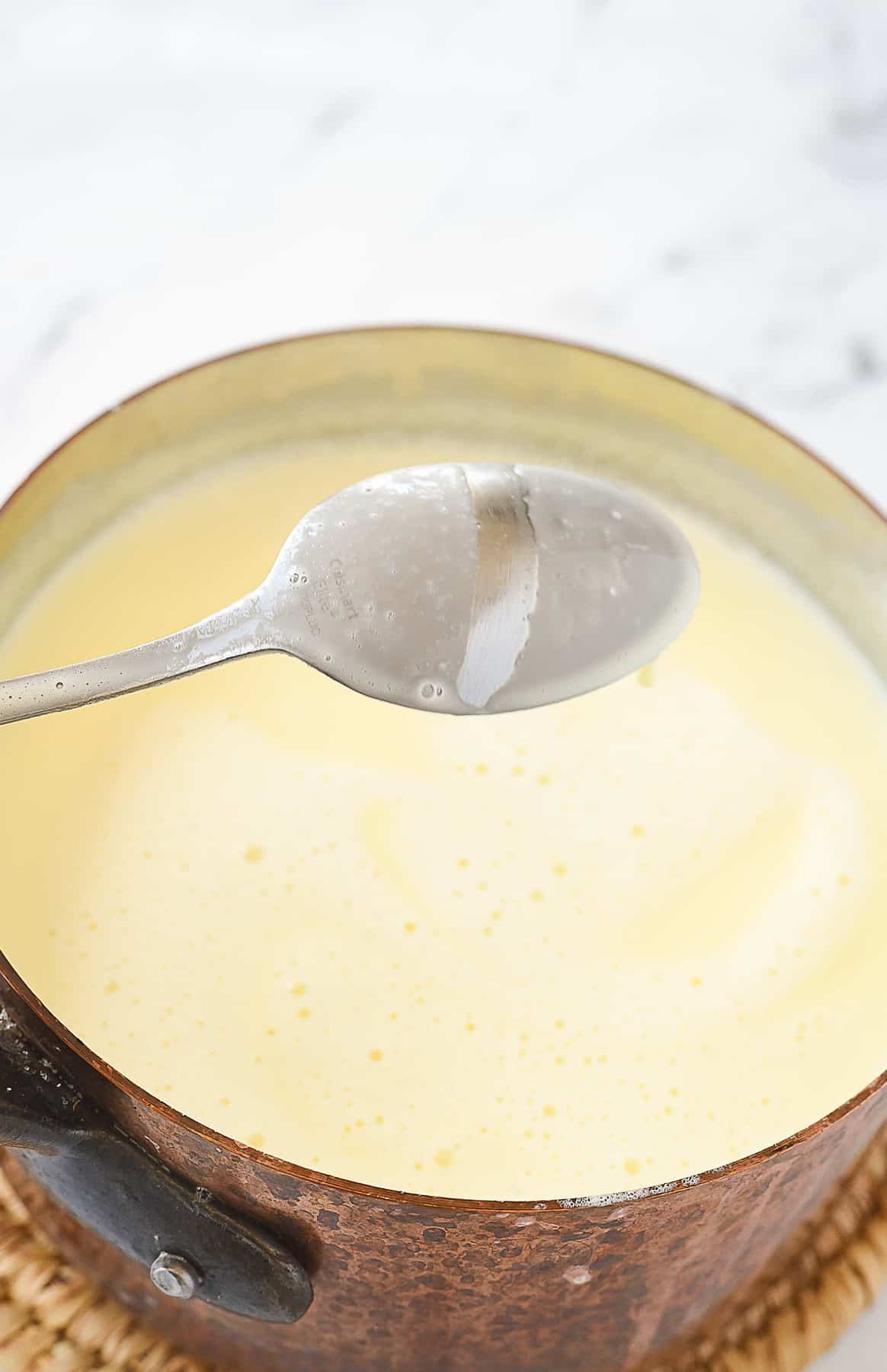 custard coating the back of the spoon