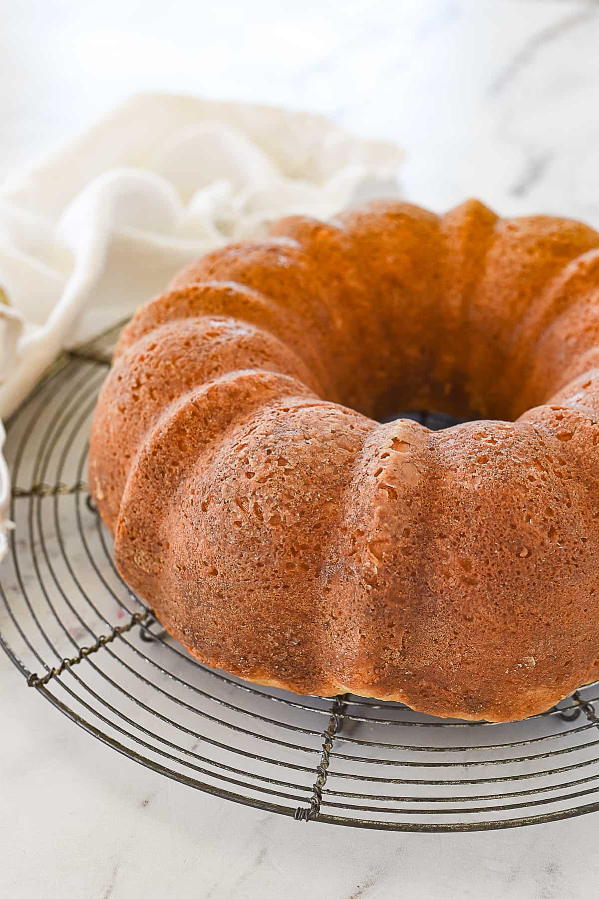 white chocolate raspberry bundt cake out of pan