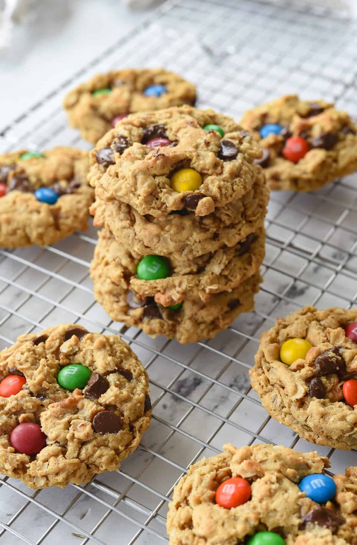 stack of monster cookies on cooling rack