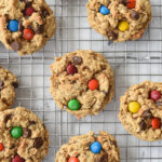 overhead shot of monster cookies on a cooling rack