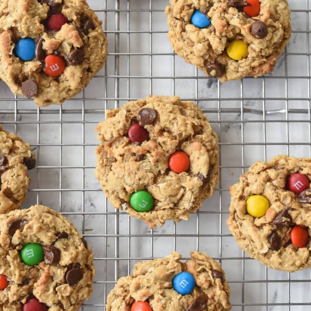 overhead shot of monster cookies on a cooling rack