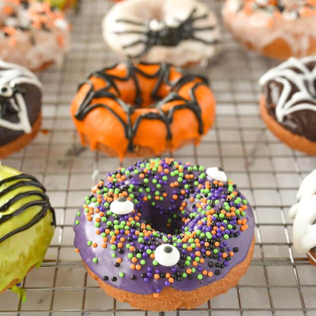 halloween donuts on a cooling rack