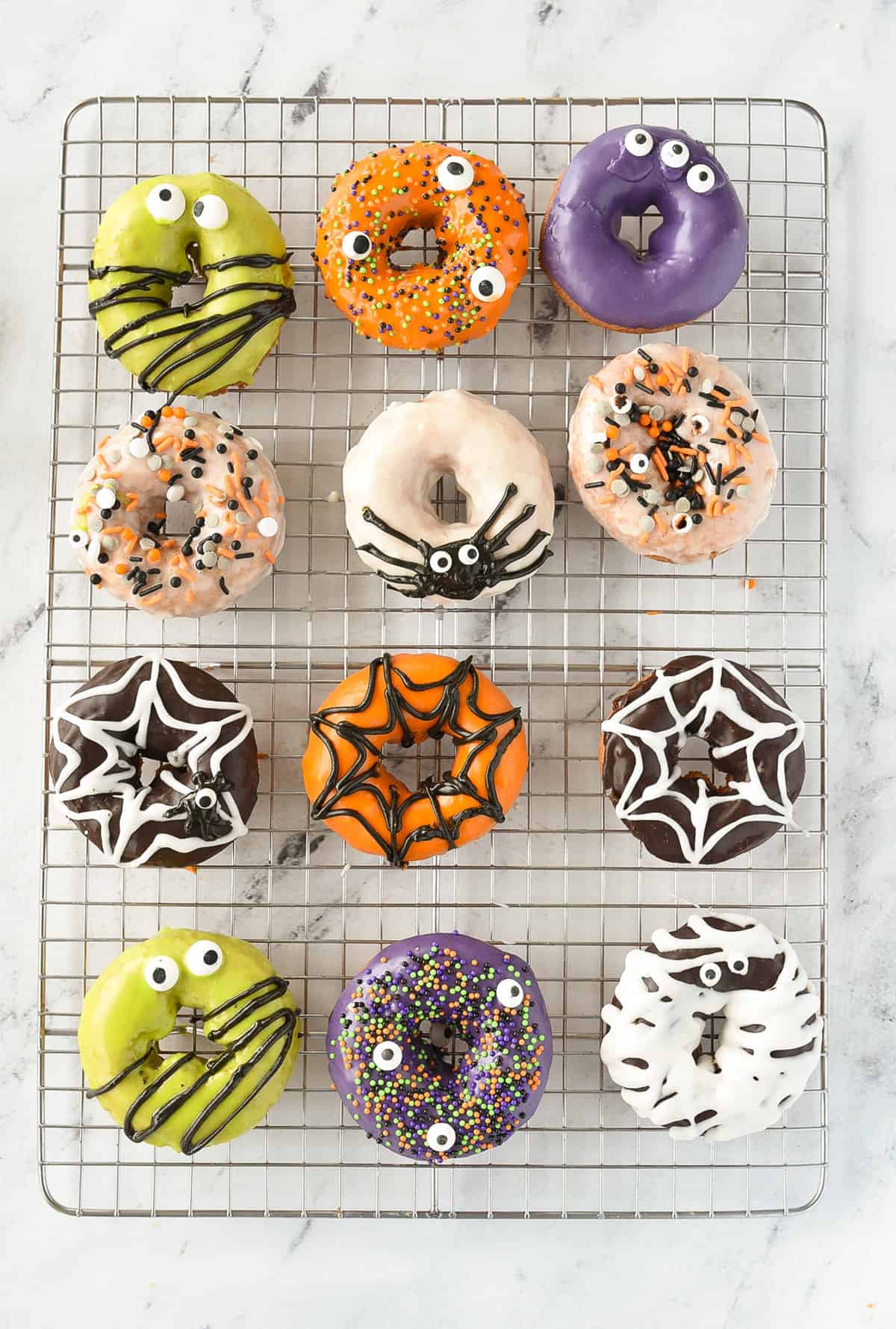 overhead shot of halloween donuts on a cooling rack