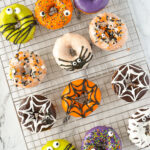 overhead shot of halloween donuts on a cooling rack