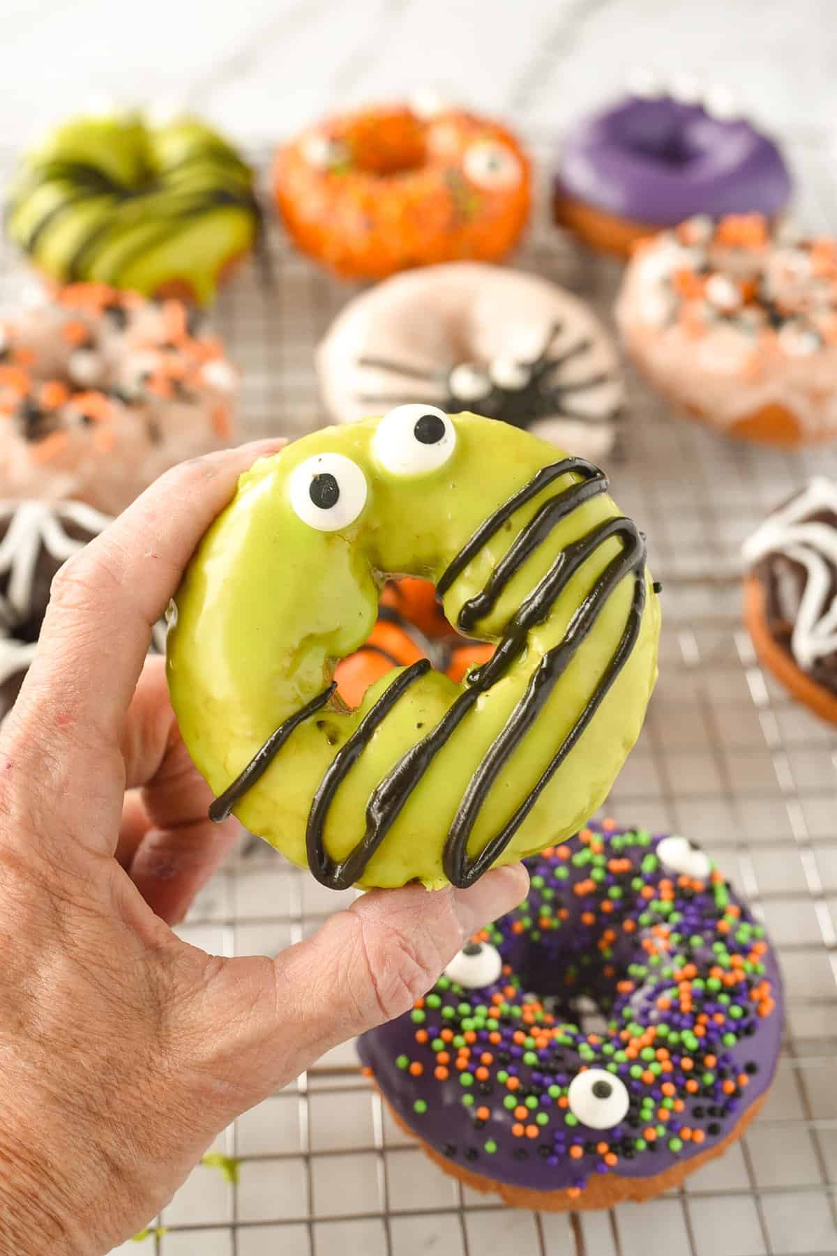 hand holding a halloween donut