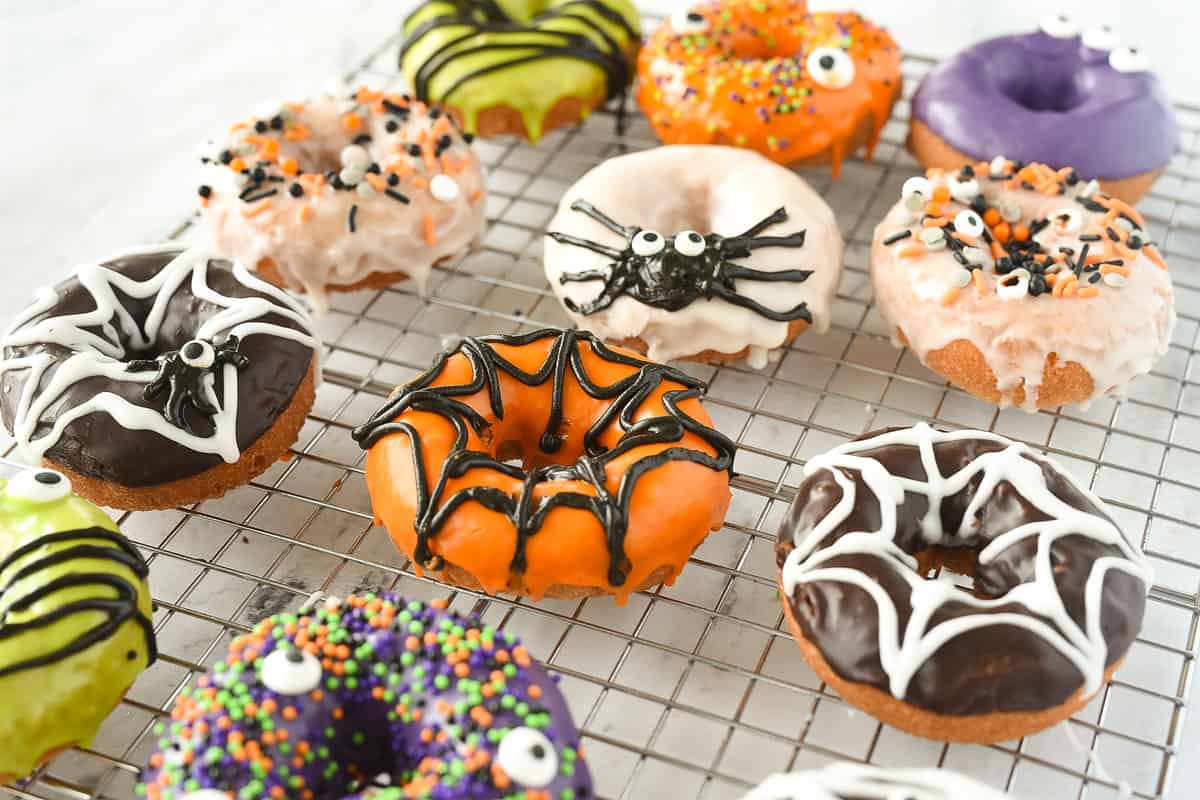 Halloween donuts on a cooling rack