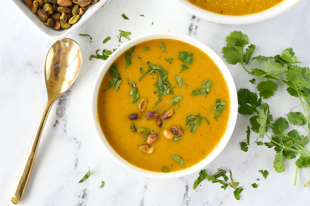 bowl of butternut squash soup with cilantro on top