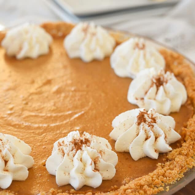 view of pumpkin pie with whipped cream on top