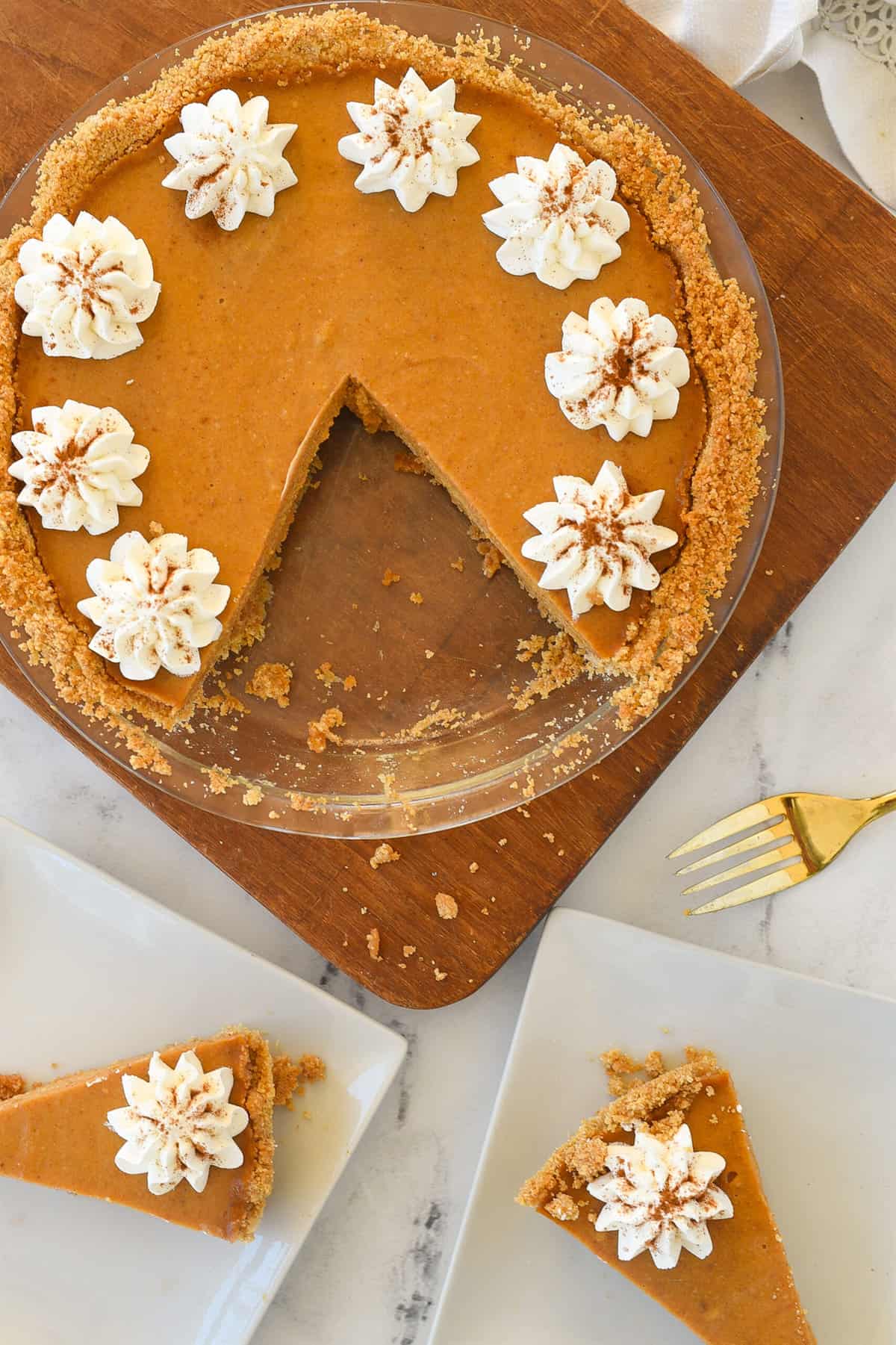 pumpkin pie with two pieces missing