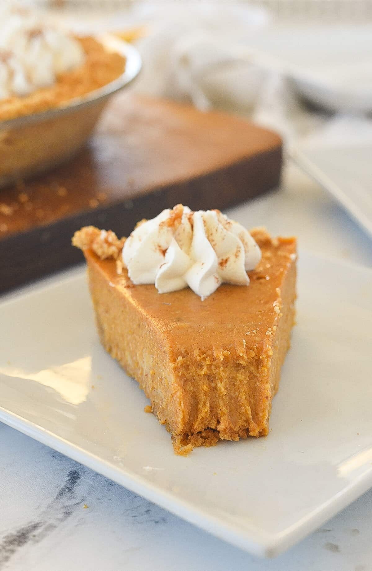 piece of pumpkin pie with a bite missing