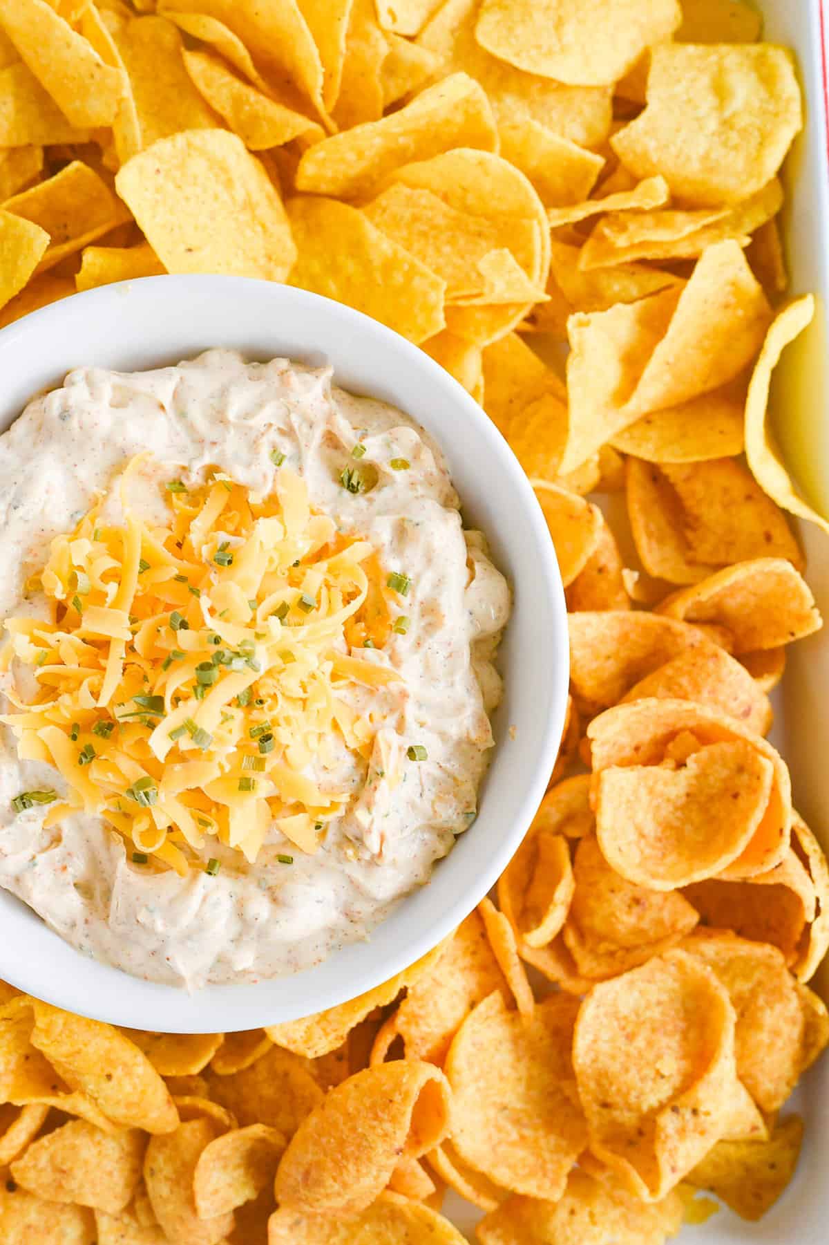 cheese on top of fiesta ranch dip with chips