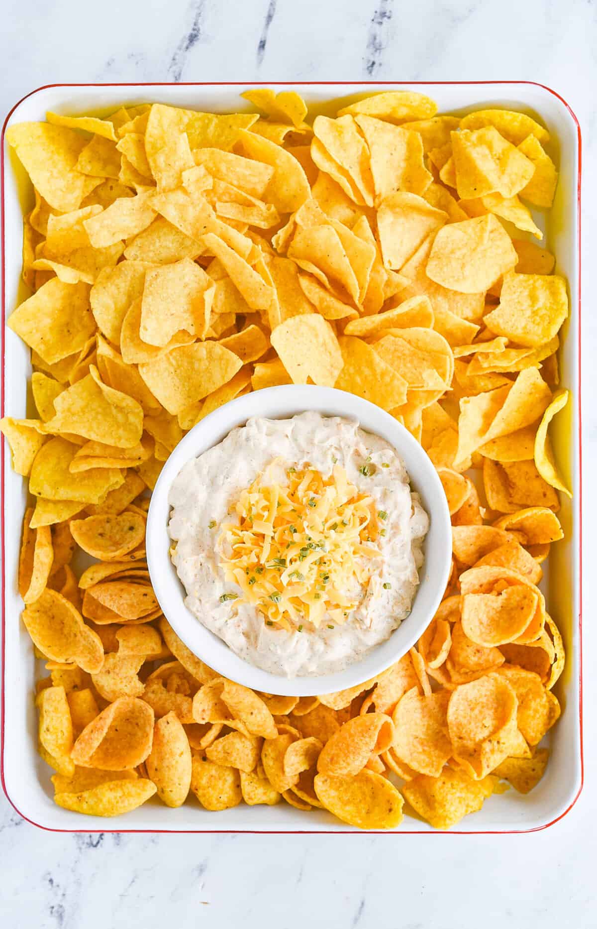 overhead shot of tray with chips on it and fiesta ranch dip