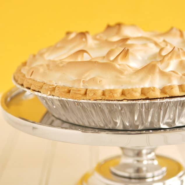 lemon meringue pie on a cake stand