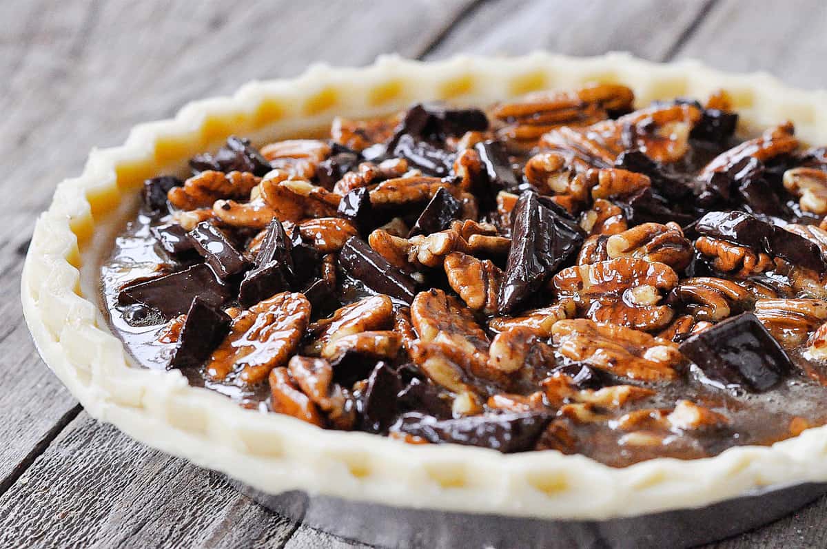 chocolate pecan pie filling in an unbaked crust