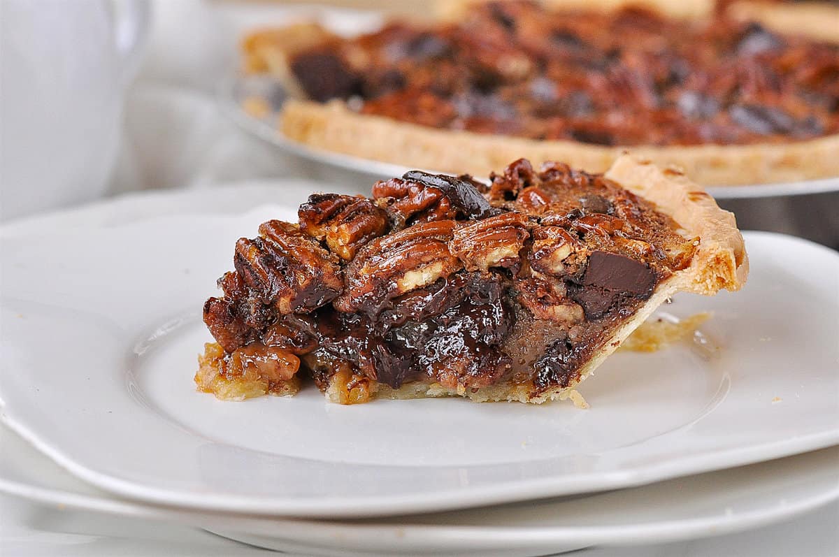 SLICE OF CHOCOLATE PECAN PIE ON A PLATE