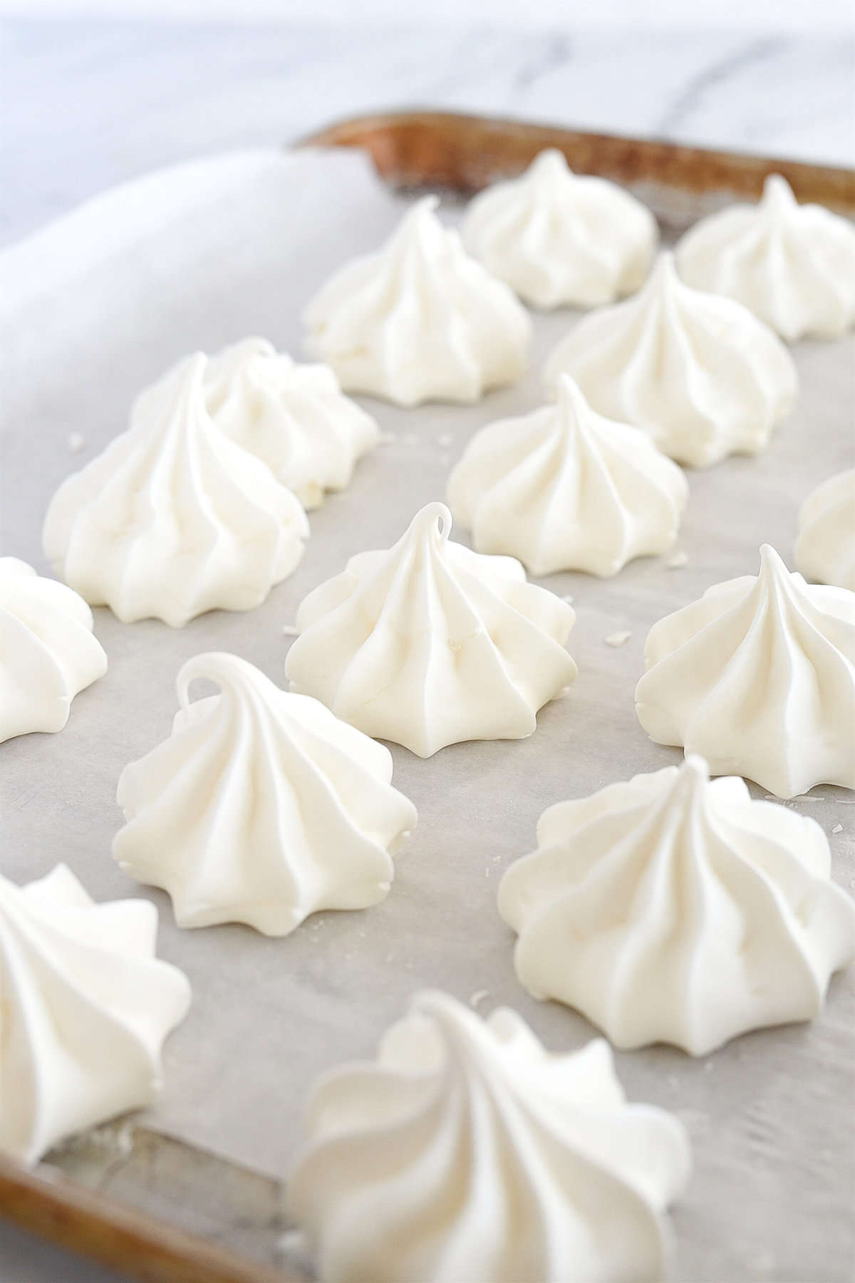 baked meringues on a cookie sheet