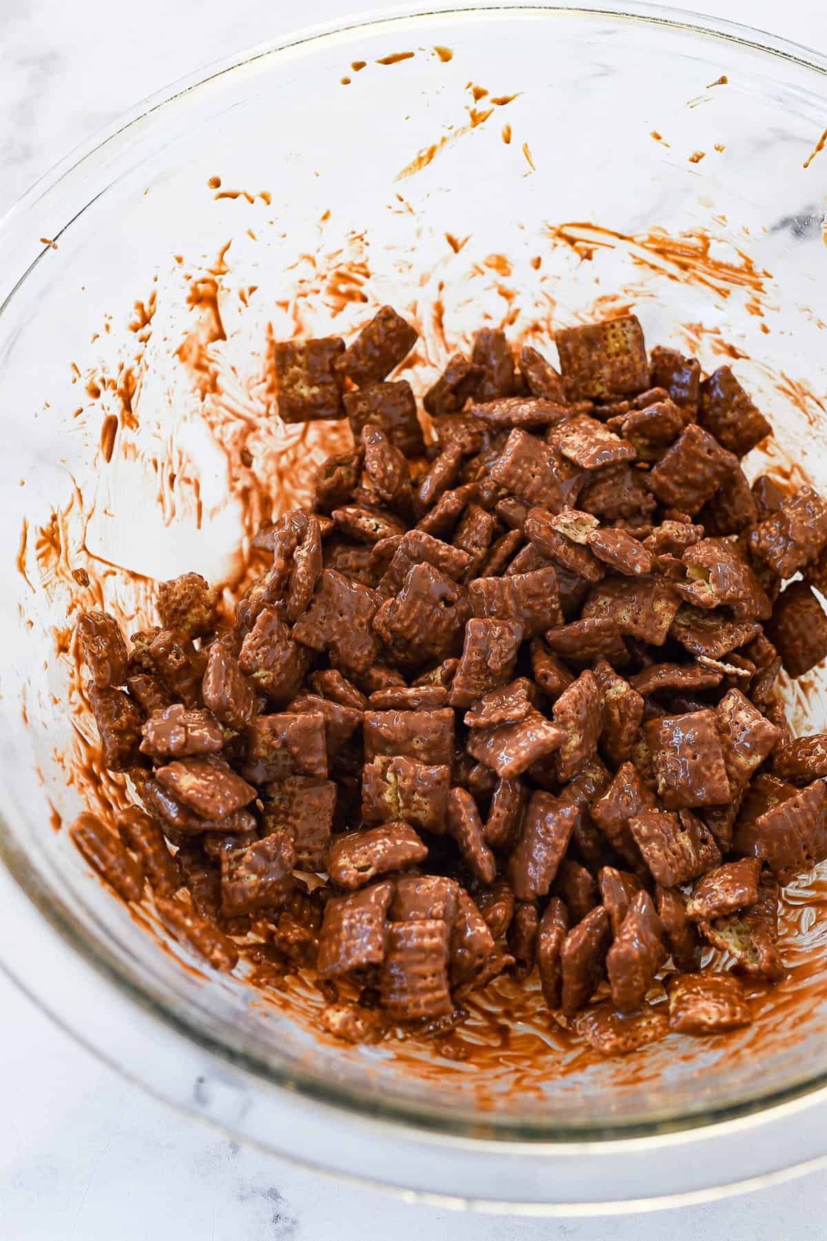 chex mix covered in chocolate and peanut butter