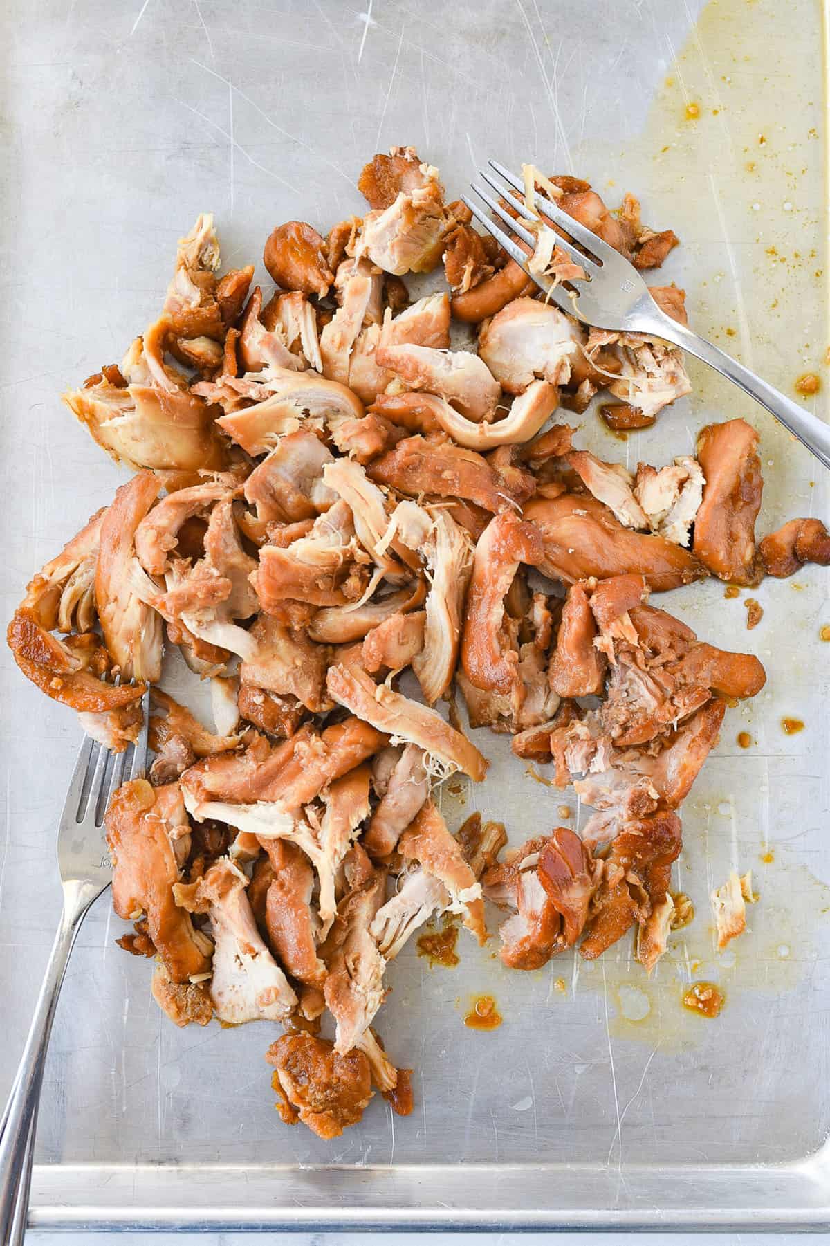 shredded Hawaiian chicken on a cookie sheet