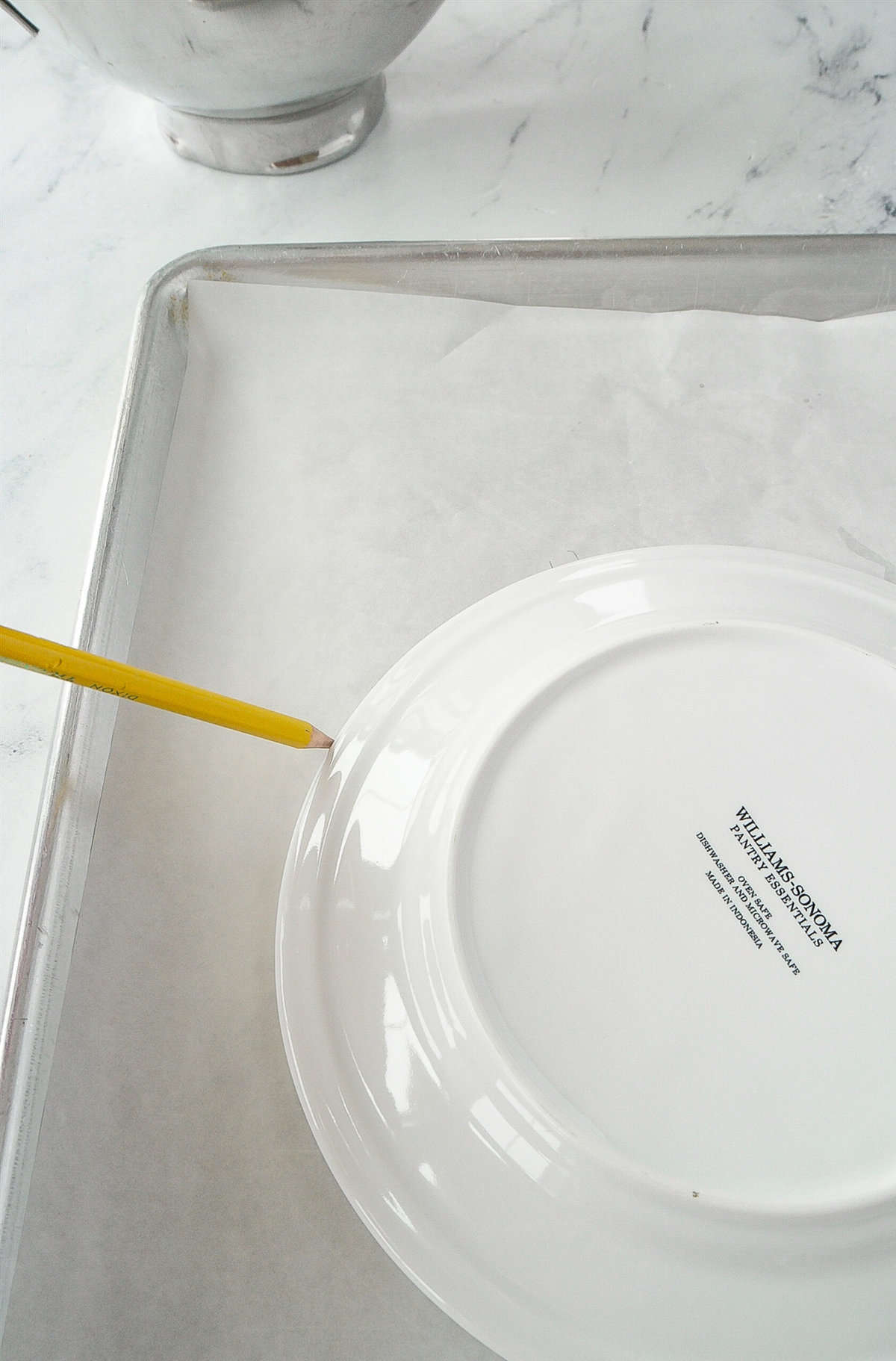 tracing around a plate onto parchment paper