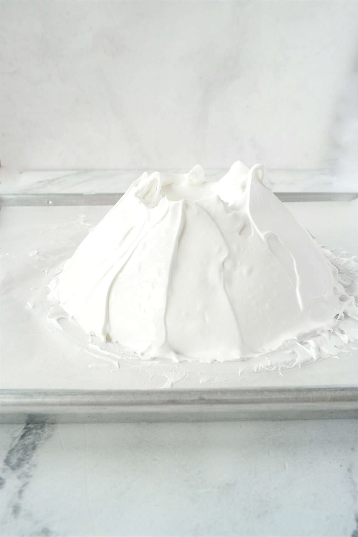 pavlova formed on a baking sheet