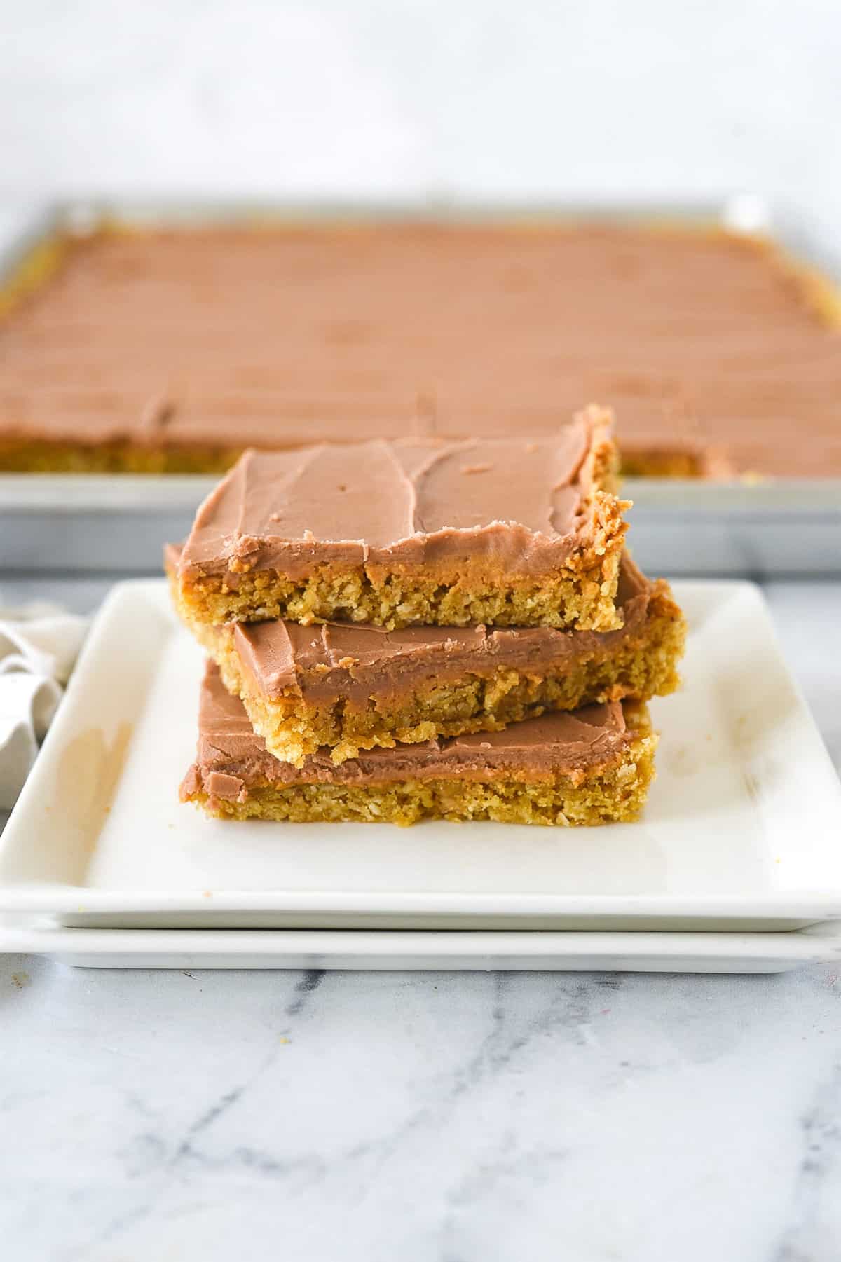 stack of peanut butter bars on a plate
