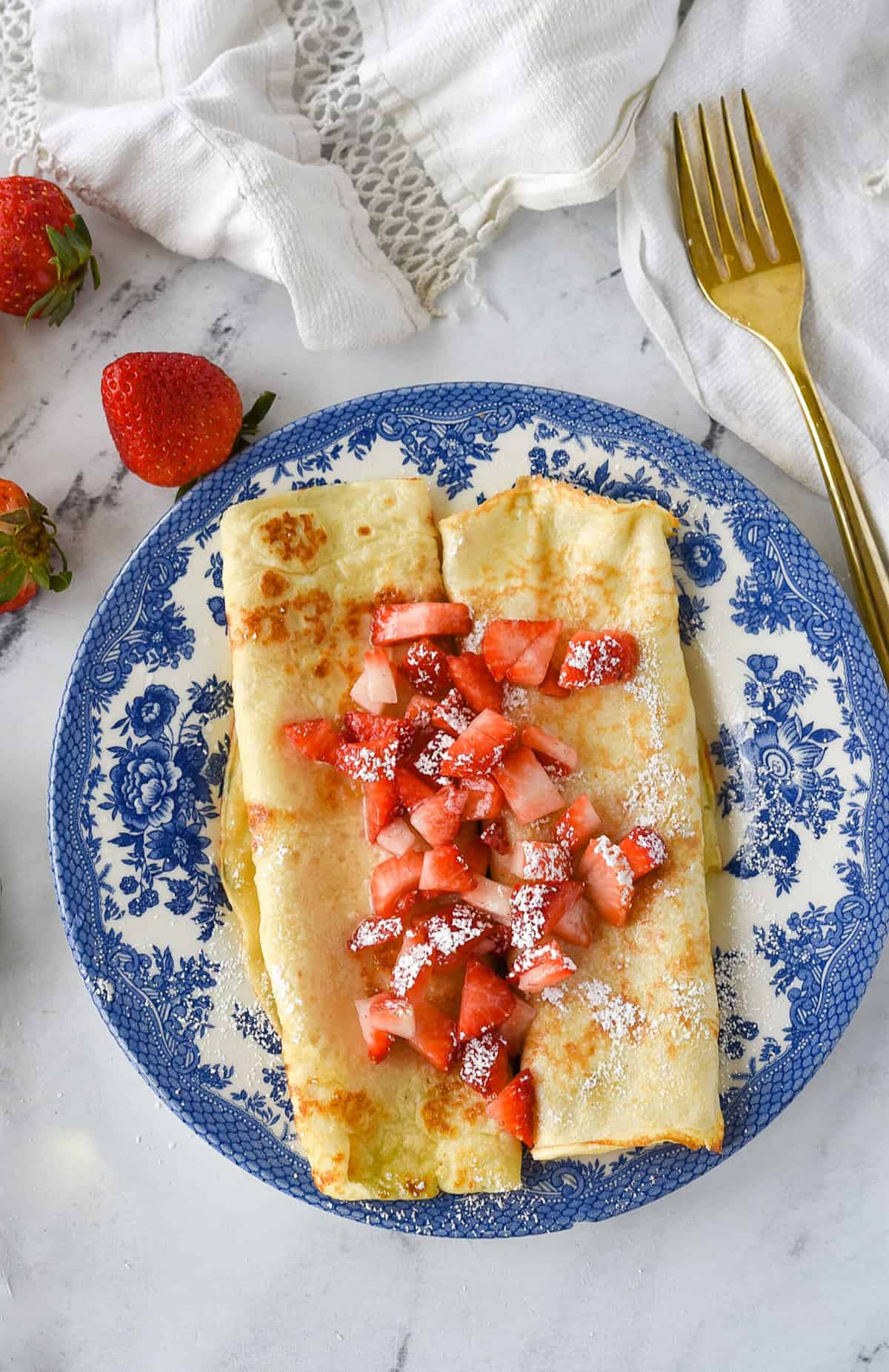 overhead shot of two swedish pancake s on a plate